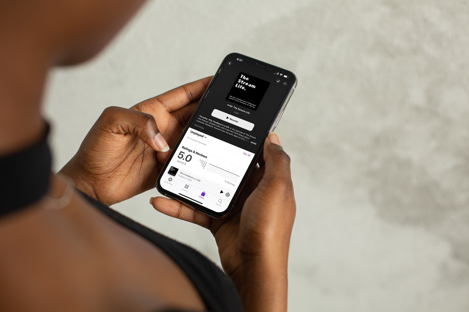 mockuuups-young-lady-holding-an-iphone-12-mockup