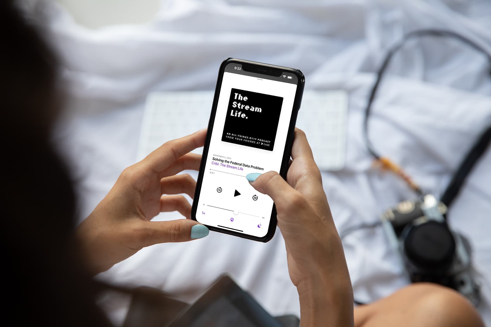 mockuuups-mockup-of-lady-holding-an-iphone-in-bed